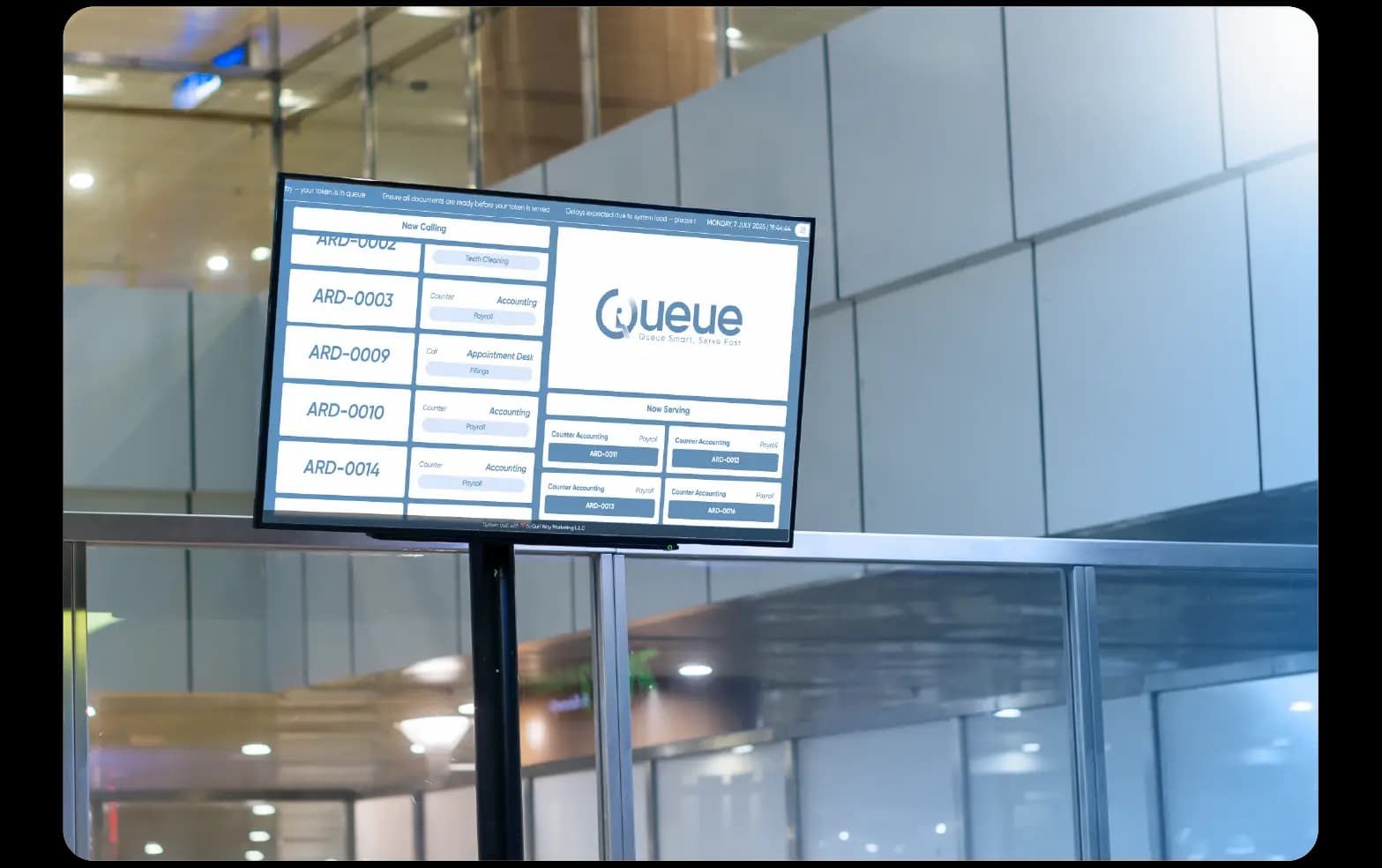 Digital signage display showing live queue status